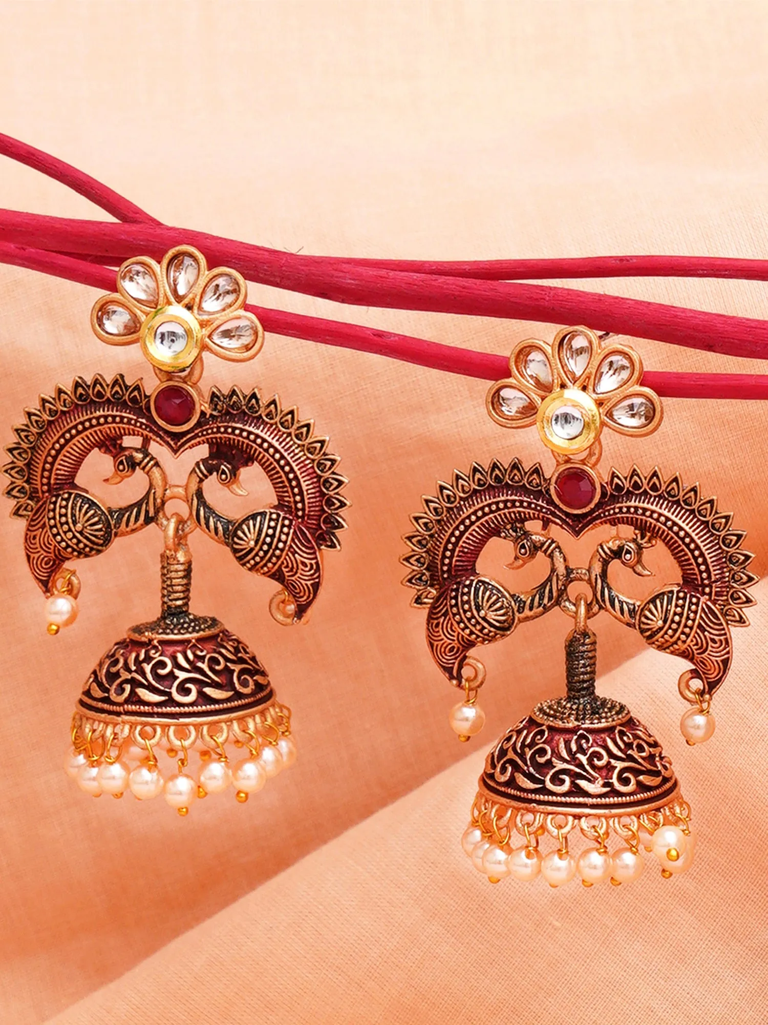 Karatcart Antique Gold Plated Maroon Designer Peacock Jhumki Earrings for Women